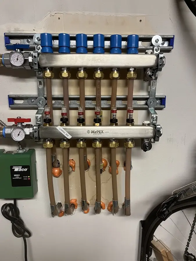 Plumber performing Water Heater Repair at a residential property in Friendship Heights Village